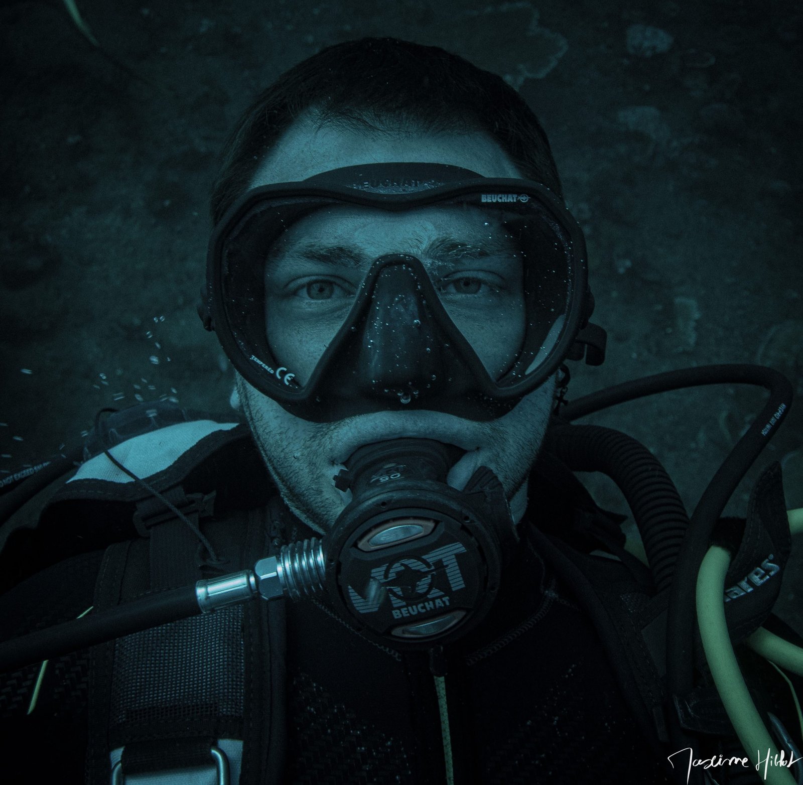 Plunge into the world of diving with this striking portrait taken by Maxime Hiblot at the USAT Liberty wreck dive site in Amed, Bali. The diver and the photographer had to perfectly manage their buoyancy to capture this shot. The gaze of the diver, visible through the diving mask, emits a serene and peaceful ambiance. For more underwater adventures, follow his Instagram accounts @orquefrance and @max.hiblot. #MaximeHiblot #ScubaDiving #Bali #Amed #USATLiberty #WreckDive #Buoyancy #Portrait #UnderwaterPhotography